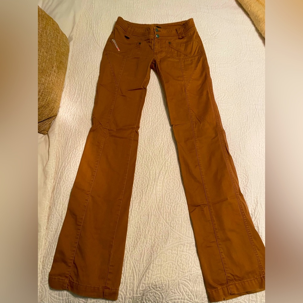 Burnt orange flare leg Diesel pants. Super cute for Longhorn game day.